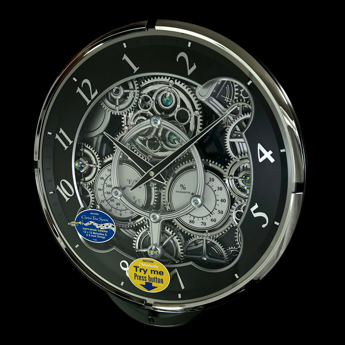 Rhythm “Chronograph (Black/Silver)” Skeletonized Dial Magic Motion Musical Wall Clock with Moving Gears - 4MH442WU08