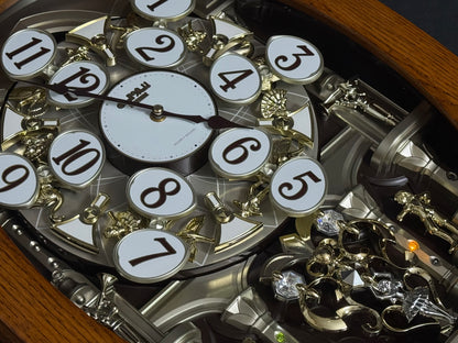 Rhythm "SSS Encore" Magic Motion Musical Wooden Wall Clock with Animated Moving Dial and Popular Melodies - 4MH810-R06