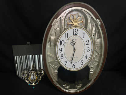 Seiko QXM369BRH “Golden Citadel” Melodies in Motion Musical Decorative Pendulum Wall Clock