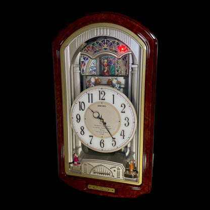 Seiko QXM123BRH "Broadway Showtunes Dropping Dial" Melodies in Motion Musical Moving Wall Clock with Popular Melodies