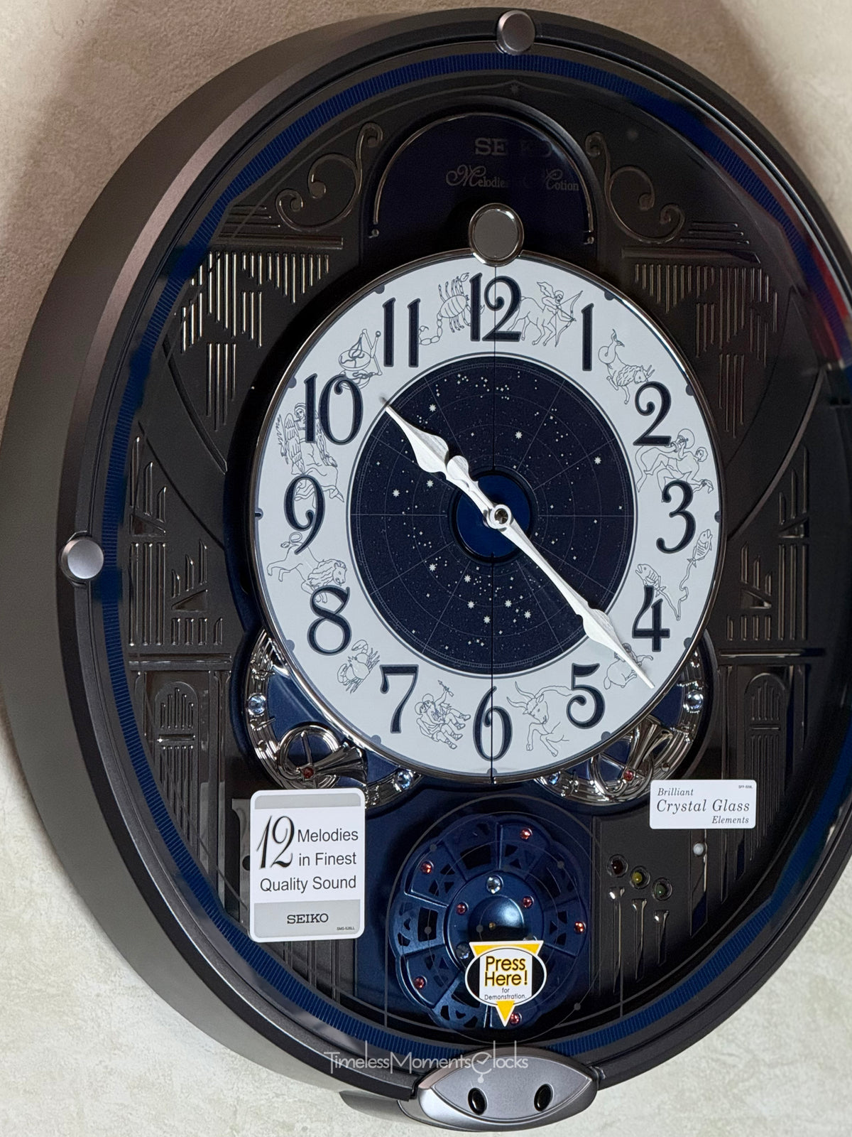 Seiko QXM393NRH “Galaxy Constellations” Astrology-Themed Melodies in Motion Moving Dial Musical Wall Clock with Luminous Dial & 12 Songs
