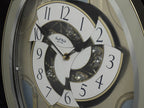 Rhythm "CTS Brilliance" Moving Dial Magic Motion Musical Wall Clock with Popular Melodies - 4MH787-R18