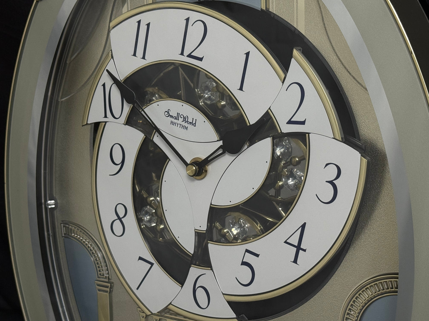 Rhythm "CTS Brilliance" Moving Dial Magic Motion Musical Wall Clock with Popular Melodies - 4MH787-R18