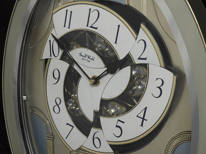 Rhythm "CTS Brilliance" Moving Dial Magic Motion Musical Wall Clock with Popular Melodies - 4MH787-R18