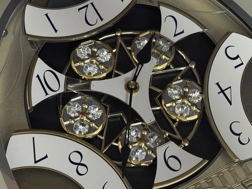 Rhythm "CTS Brilliance" Moving Dial Magic Motion Musical Wall Clock with Popular Melodies - 4MH787-R18