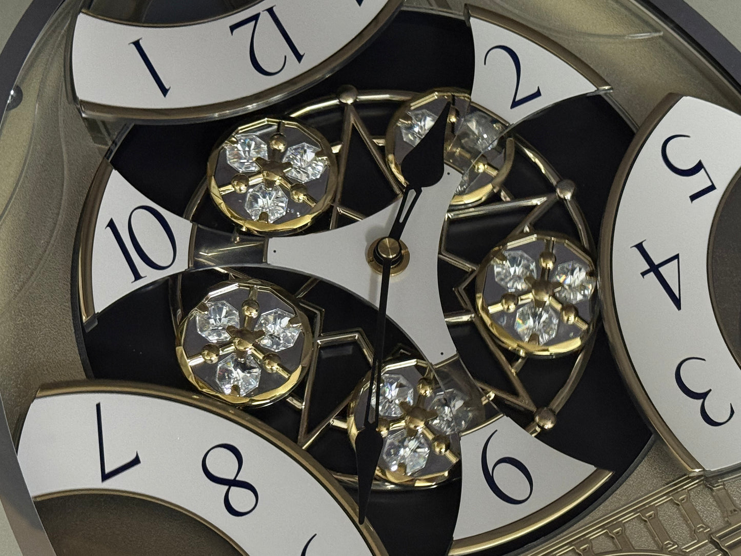 Rhythm "CTS Brilliance" Moving Dial Magic Motion Musical Wall Clock with Popular Melodies - 4MH787-R18