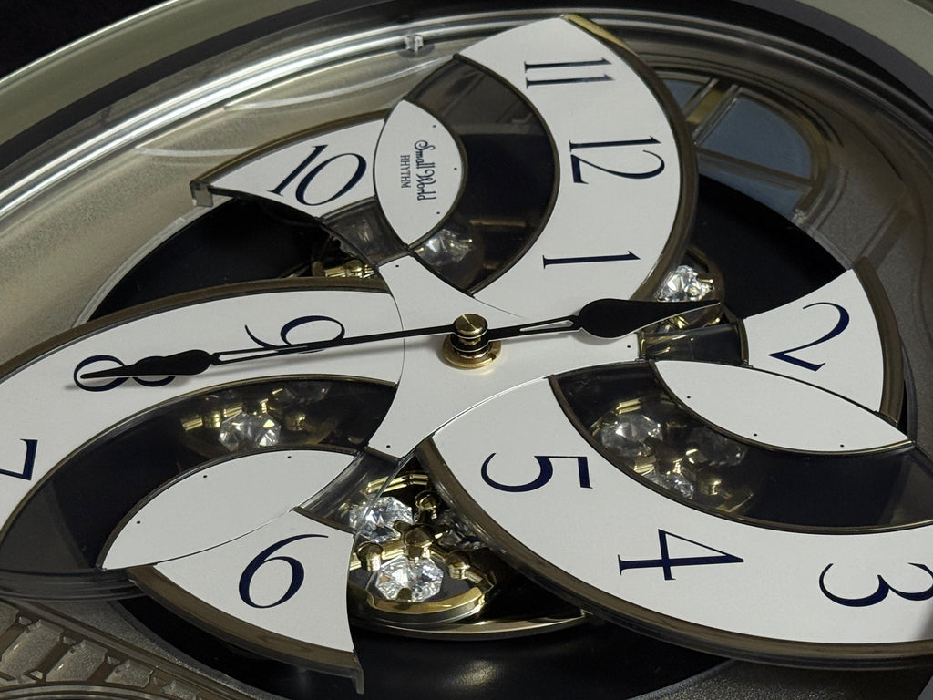Rhythm "CTS Brilliance" Moving Dial Magic Motion Musical Wall Clock with Popular Melodies - 4MH787-R18