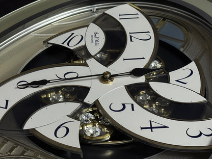 Rhythm "CTS Brilliance" Moving Dial Magic Motion Musical Wall Clock with Popular Melodies - 4MH787-R18