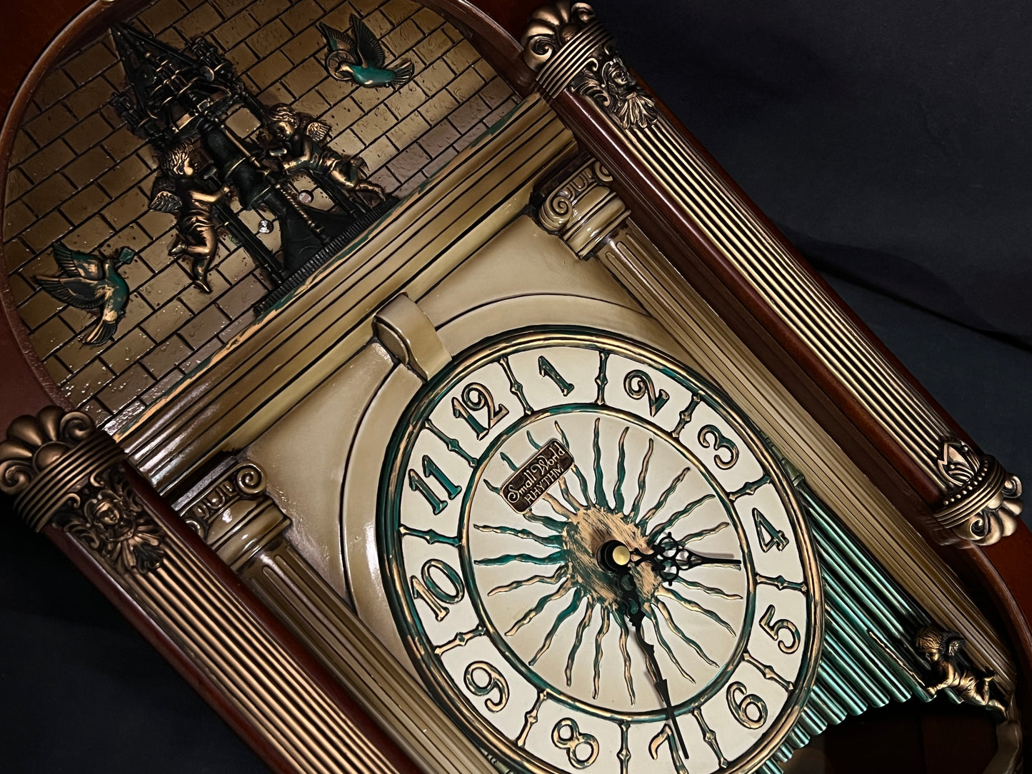 Rhythm “CTS Sundial” Gothic Wooden Musical Motion Pendulum Wall Clock with Popular Melodies - CMJ336UR06