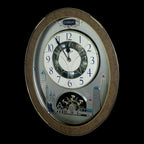 Rhythm “Tri-Cracker” Moving Dial Magic Motion Musical Wall Clock with Popular Melodies - 4MH759NR06