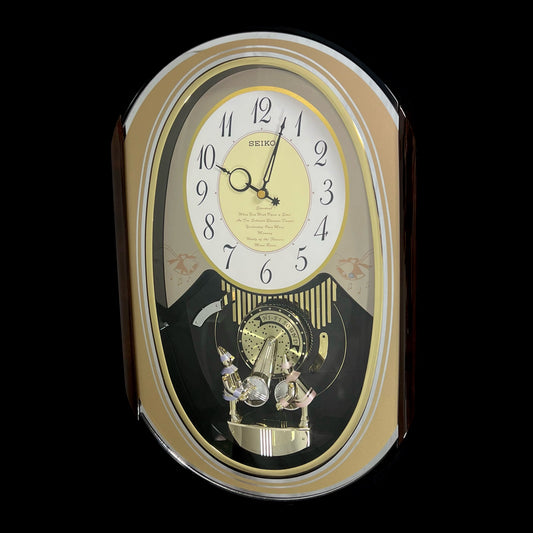 Seiko QXM124GRH "Music Disc Figurines" Melodies in Motion Musical Moving Wall Clock with Popular Music