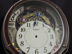 Rhythm "Harmony Blessing" Moving Dial Magic Motion Musical Wall Clock - 4MH423WR23