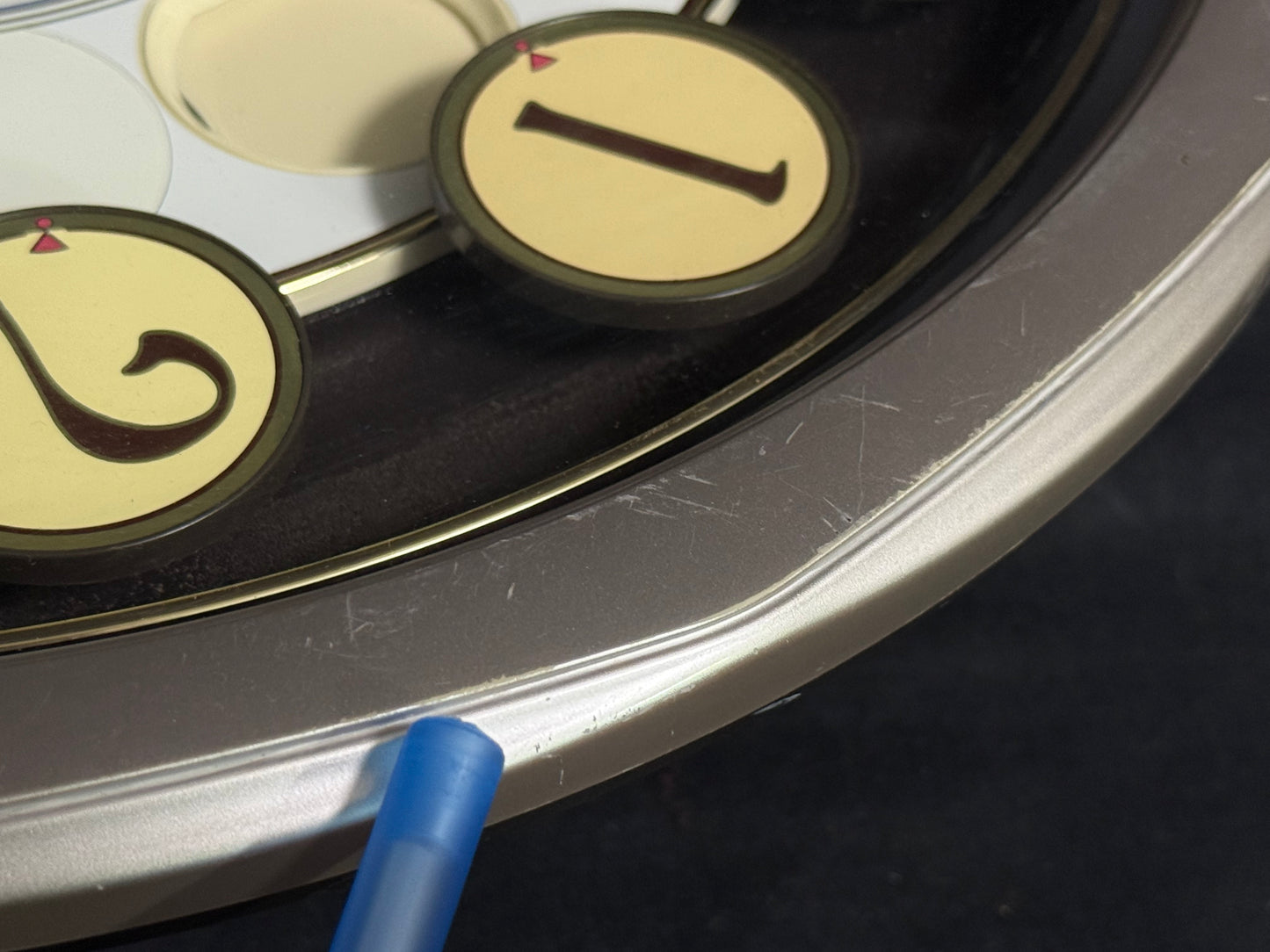 Seiko QXM106SRH "Twirling Numbers" Melodies in Motion Musical Wall Clock with Moving Dial