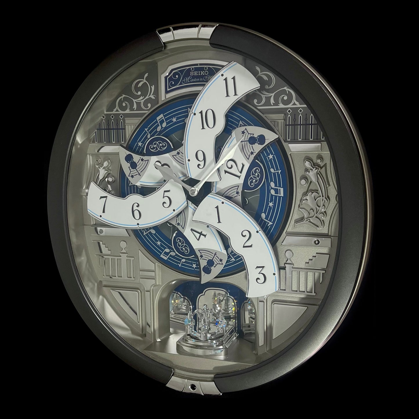 Seiko QXM366SRH “Musical Motifs” Melodies in Motion Dancing Dial Musical Wall Clock