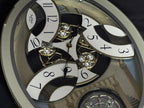 Rhythm "CTS Brilliance" Moving Dial Magic Motion Musical Wall Clock with Popular Melodies - 4MH787-R18