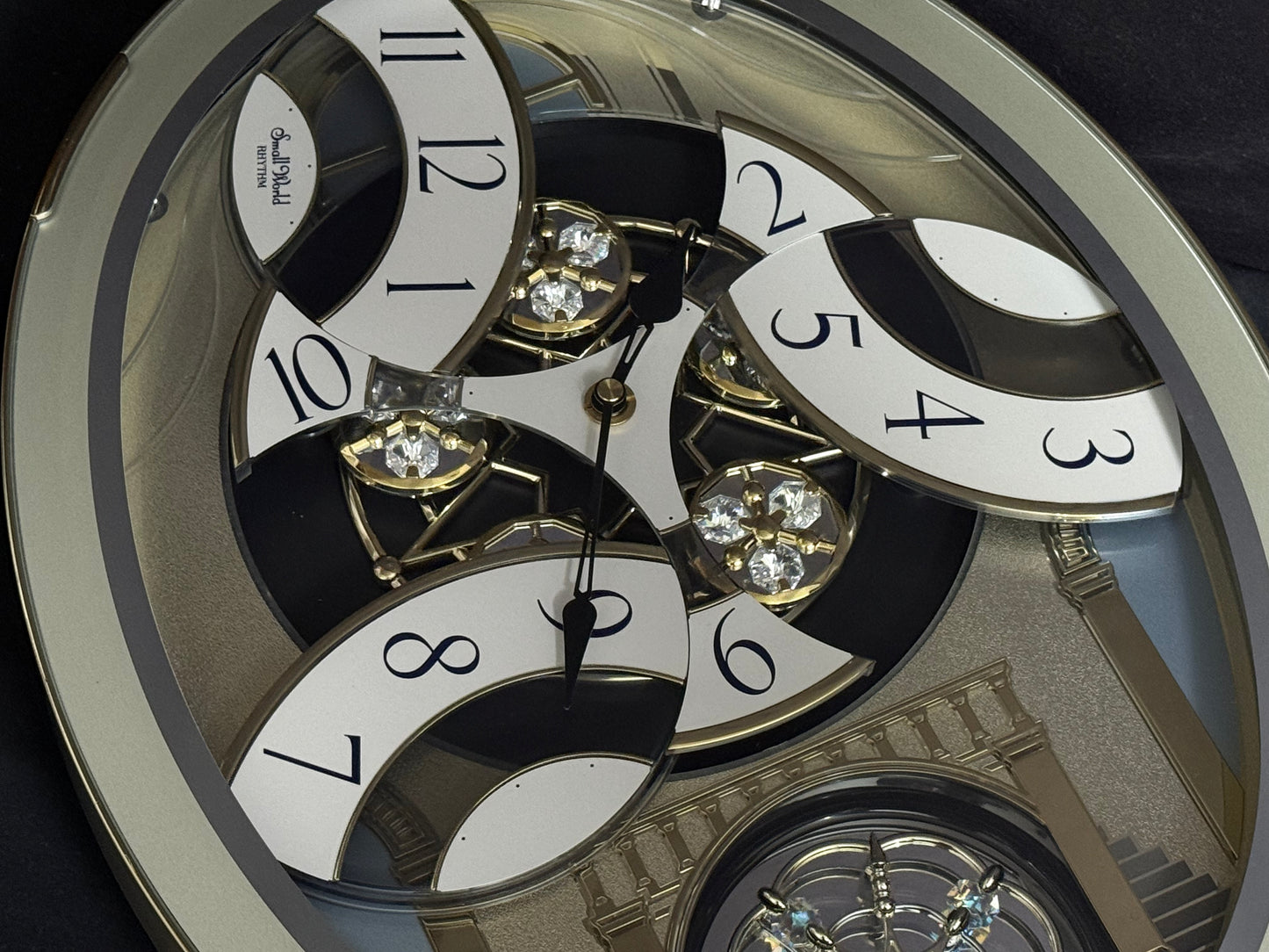 Rhythm "CTS Brilliance" Moving Dial Magic Motion Musical Wall Clock with Popular Melodies - 4MH787-R18