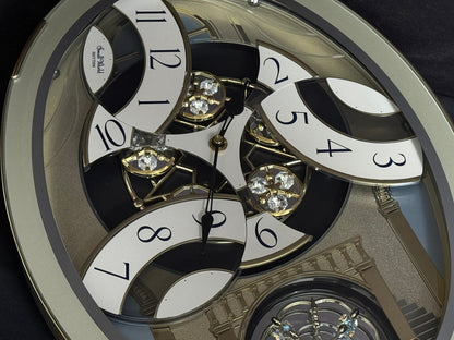 Rhythm "CTS Brilliance" Moving Dial Magic Motion Musical Wall Clock with Popular Melodies - 4MH787-R18