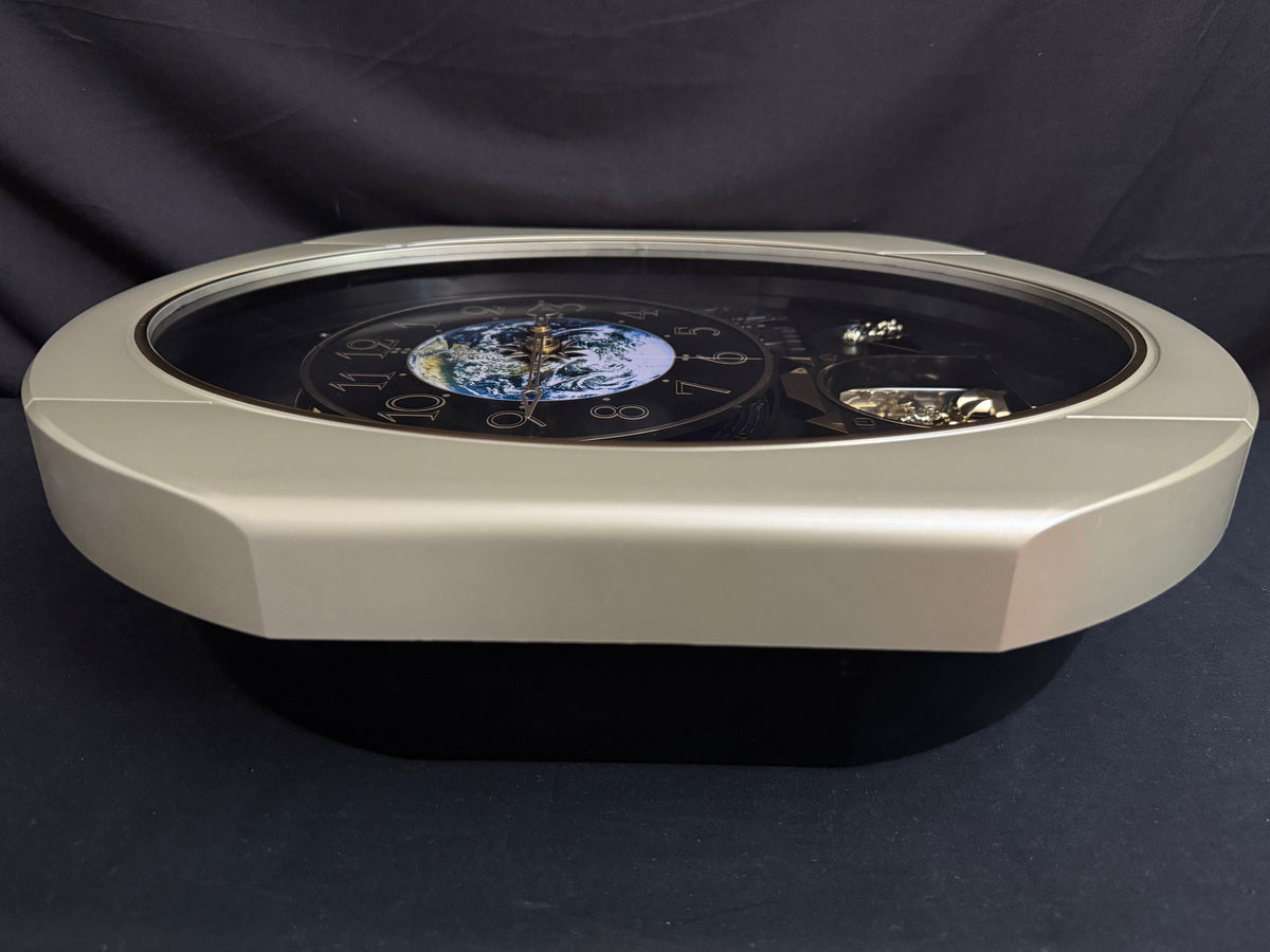 Rhythm “Peaceful Cosmos Entertainer” Moving Earth Dial Magic Motion Musical Wall Clock with Popular Melodies - 4MH839WB19