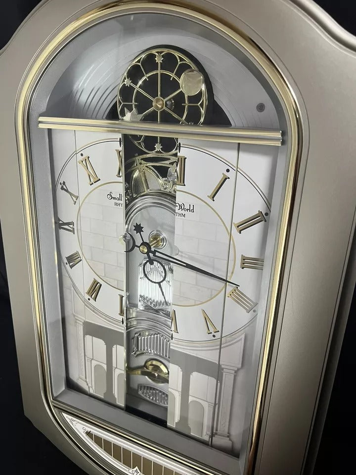 Rhyth Clock Rhythm “Renaissance” Magic Motion Musical Wall Clock with Moving Dial ...