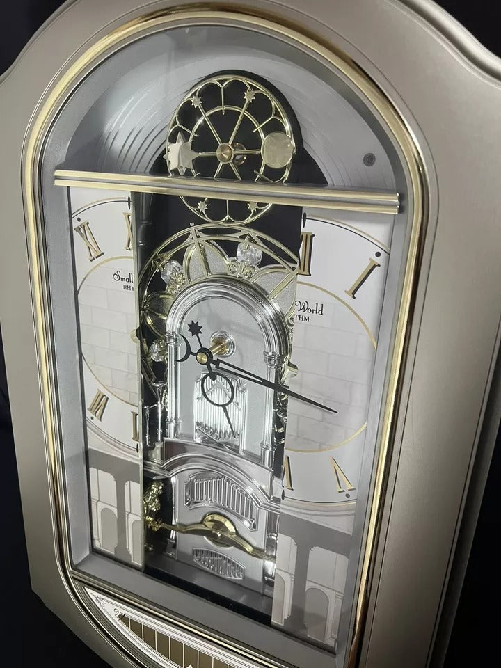 Rhythm “Renaissance” Magic Motion Musical Wall Clock with Moving Dial ...