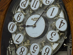 Rhythm "SSS Encore" Magic Motion Musical Wooden Wall Clock with Animated Moving Dial and Popular Melodies - 4MH810-R06