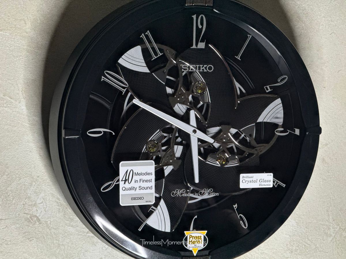 Seiko QXM621KRH “Onyx” Melodies in Motion Dancing Dial Musical Wall Clock with 40 Songs