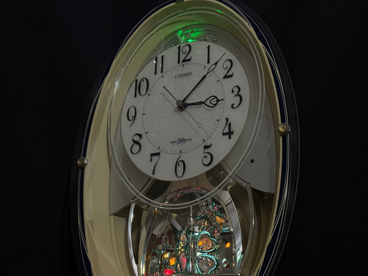 Citizen (Rhythm) "Pal Muse M482" Musical Motion Decorative Pendulum Wall Clock from Japan with LED Light Show - 4MN482-003