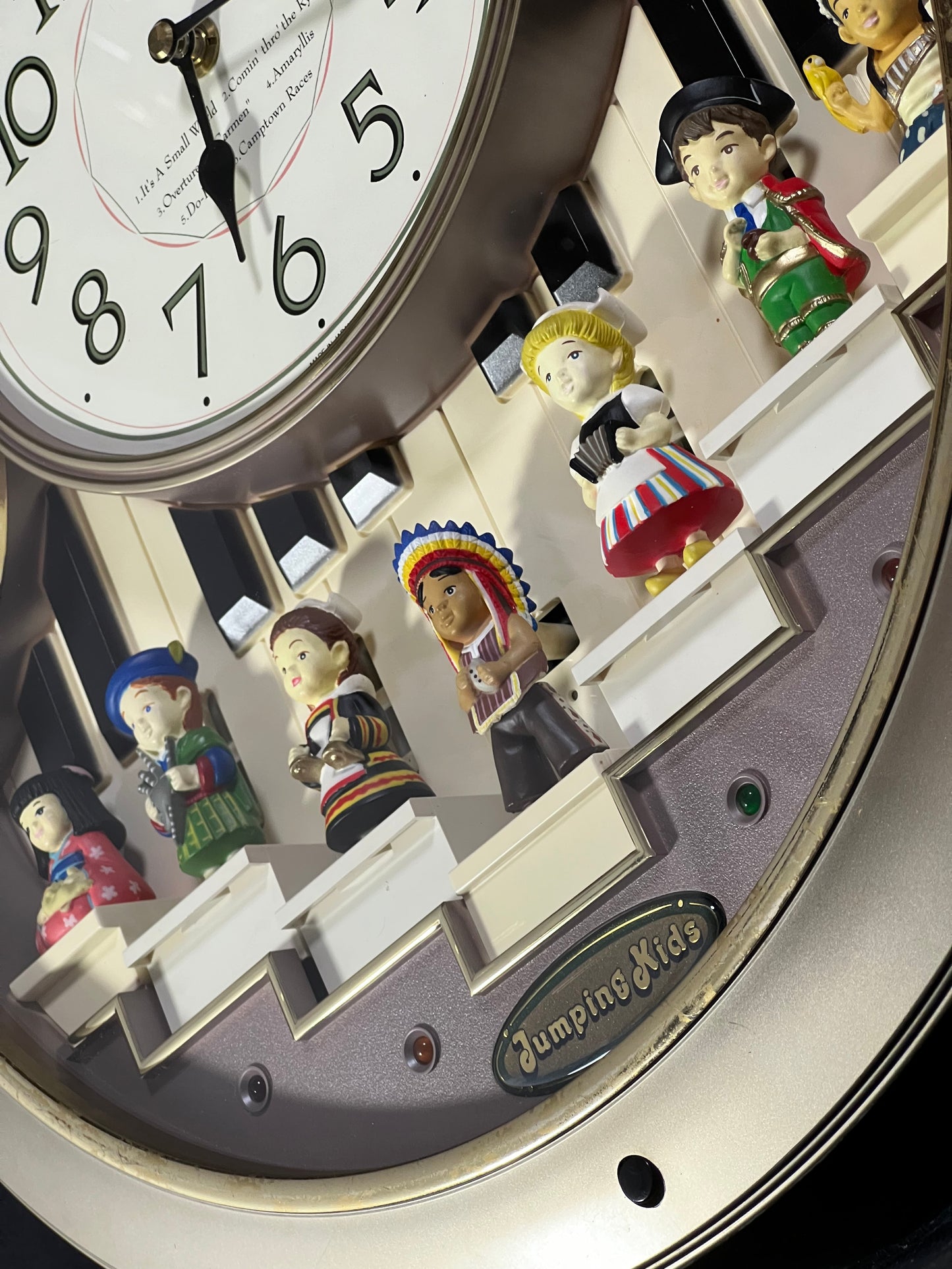Rhythm “Jumping Kids” Magic Motion Musical Wall Clock with Moving Figurines and Piano Keys - 4MH721RH18