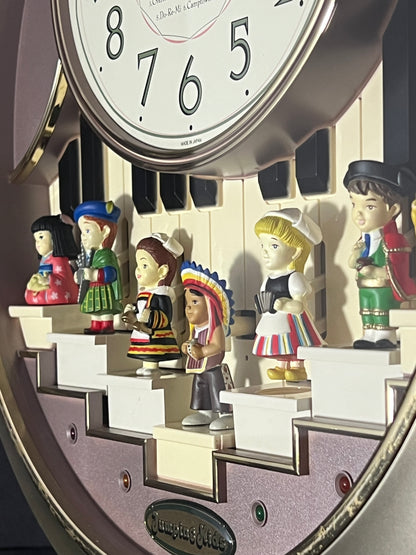 Rhythm “Jumping Kids” Magic Motion Musical Wall Clock with Moving Figurines and Piano Keys - 4MH721RH18