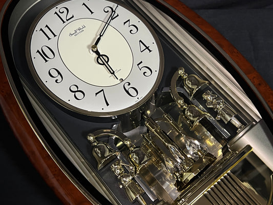 Rhythm "Golden Ringers" Magic Motion Musical Wall Clock with Animated Figurines - 4MH740NR23