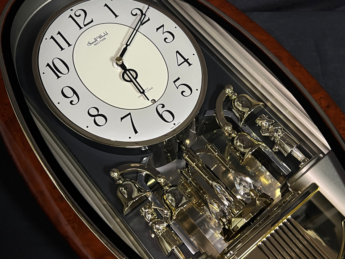 Rhythm "Golden Ringers" Magic Motion Musical Wall Clock with Animated Figurines - 4MH740NR23