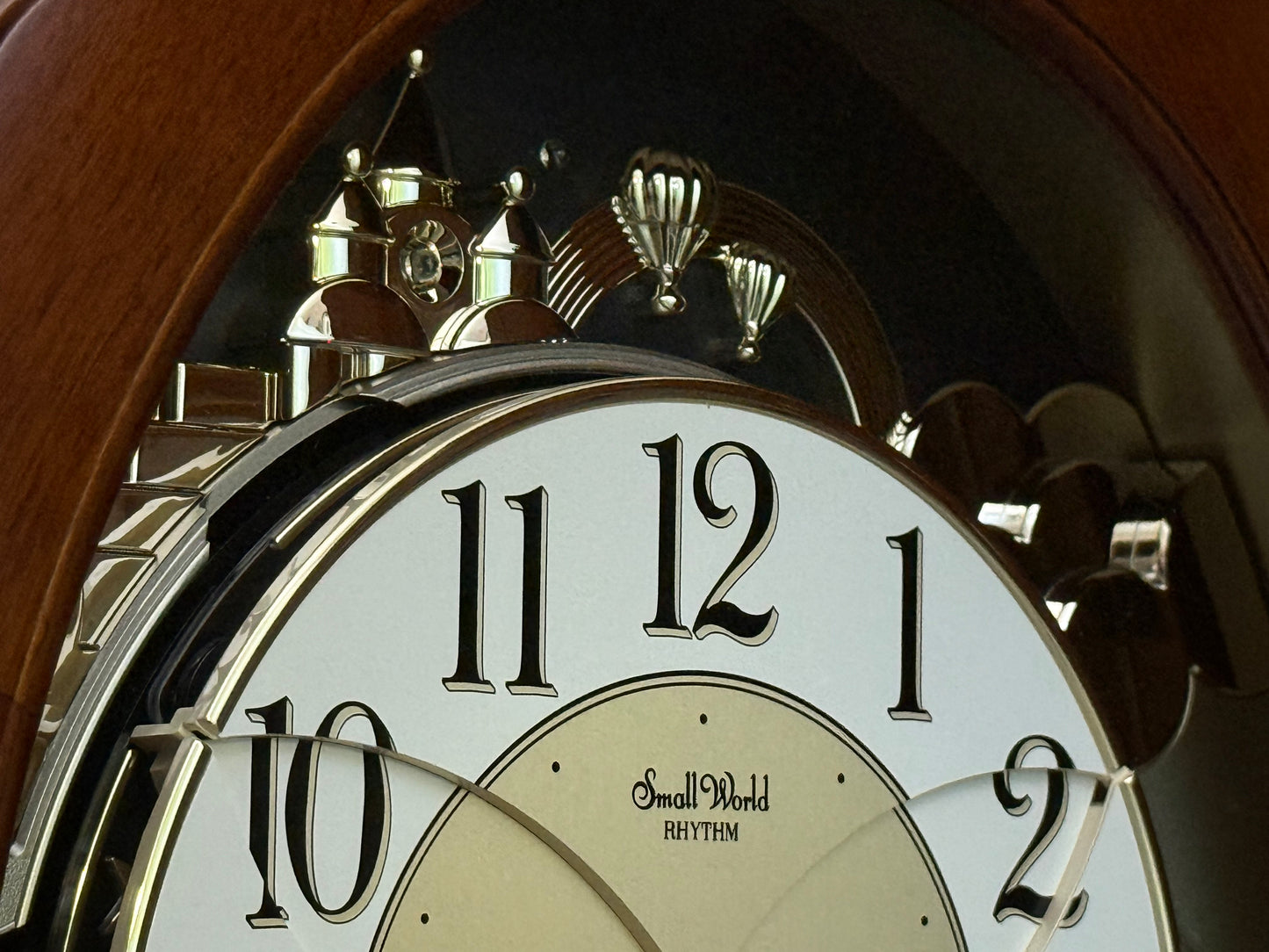 Rhythm "CTS Nostalgia" Moving Dial Magic Motion Musical Wooden Wall Clock with Popular Melodies - 4MH780-R06