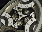 Rhythm "CTS Brilliance" Moving Dial Magic Motion Musical Wall Clock with Popular Melodies - 4MH787-R18