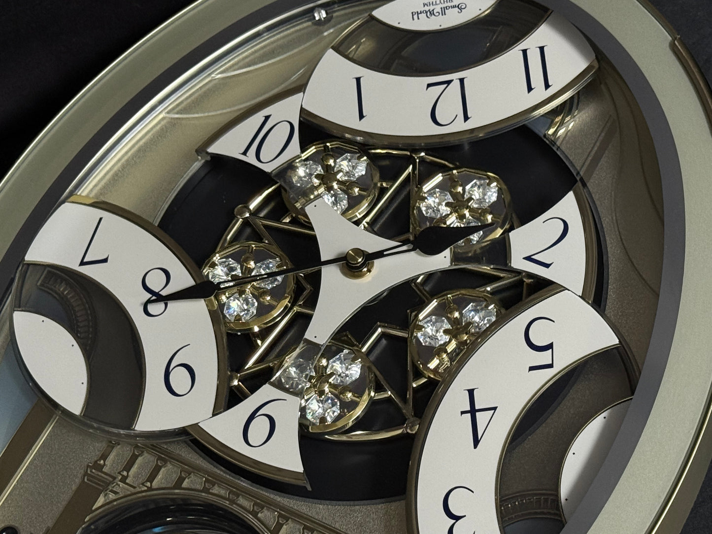 Rhythm "CTS Brilliance" Moving Dial Magic Motion Musical Wall Clock with Popular Melodies - 4MH787-R18