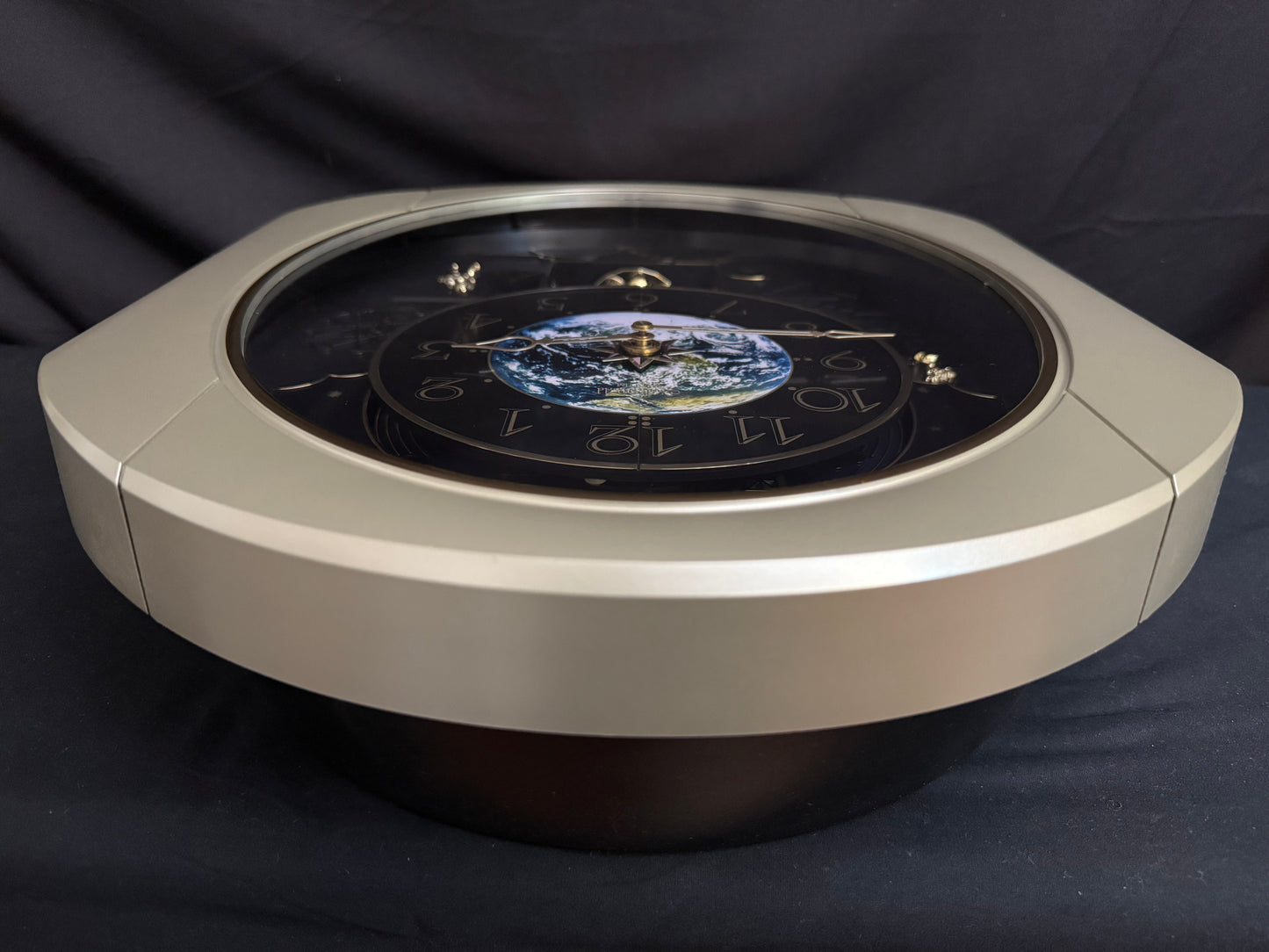 Rhythm “Peaceful Cosmos Entertainer” Moving Earth Dial Magic Motion Musical Wall Clock with Popular Melodies - 4MH839WB19
