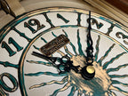 Rhythm “CTS Sundial” Gothic Wooden Musical Motion Pendulum Wall Clock with Popular Melodies - CMJ336UR06