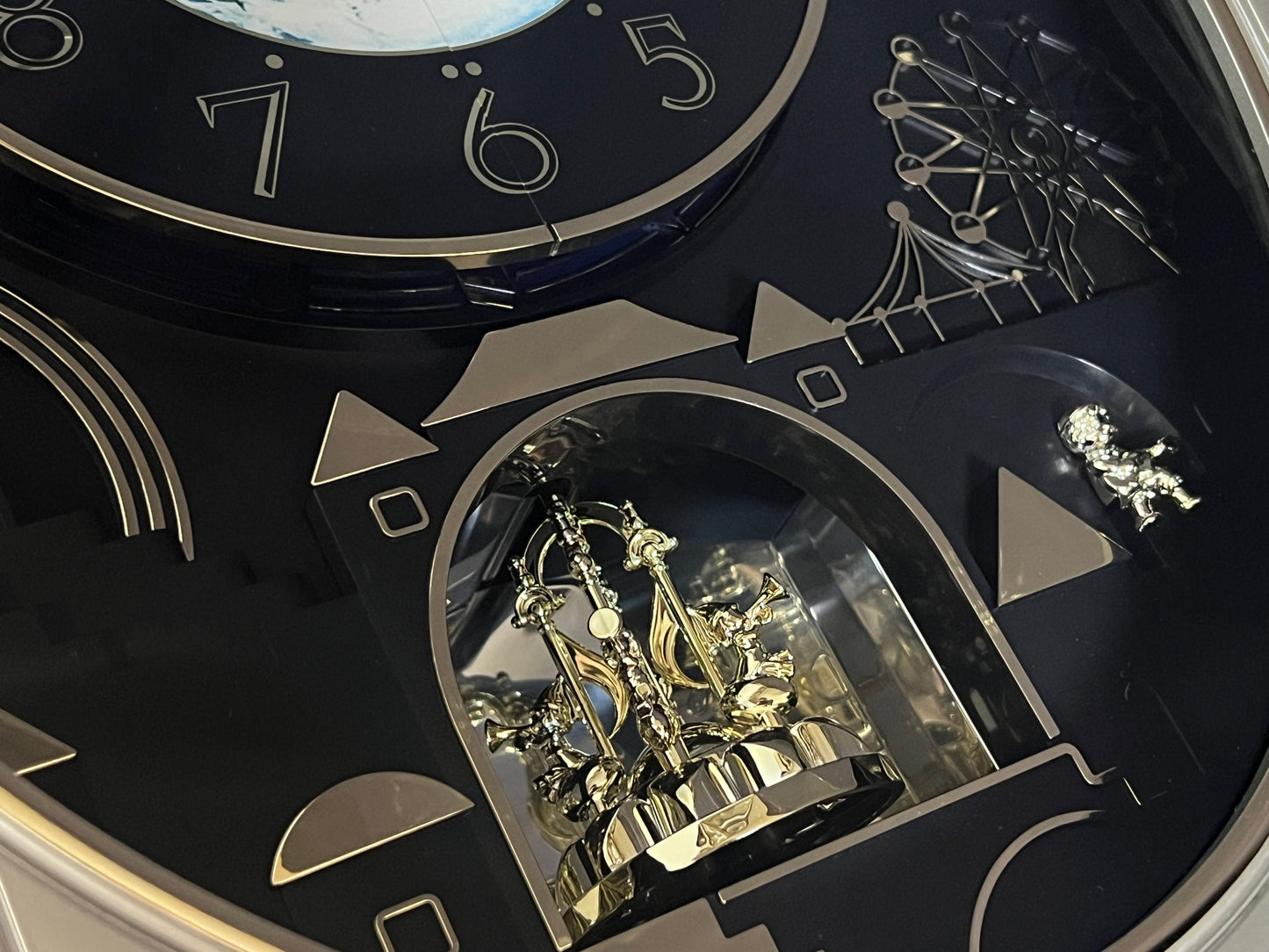 Rhythm “Peaceful Cosmos” Moving Earth Dial Magic Motion Musical Wall Clock with Popular Melodies - 4MH751AR19