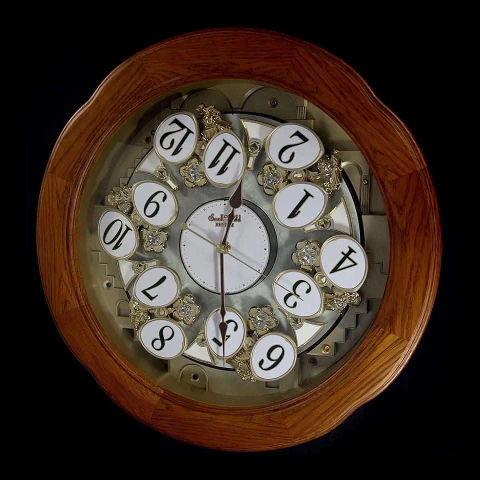 Rhythm "Angel Blossom II" Magic Motion Musical Wooden Wall Clock with Animated Moving Dial - 4MH868WD06