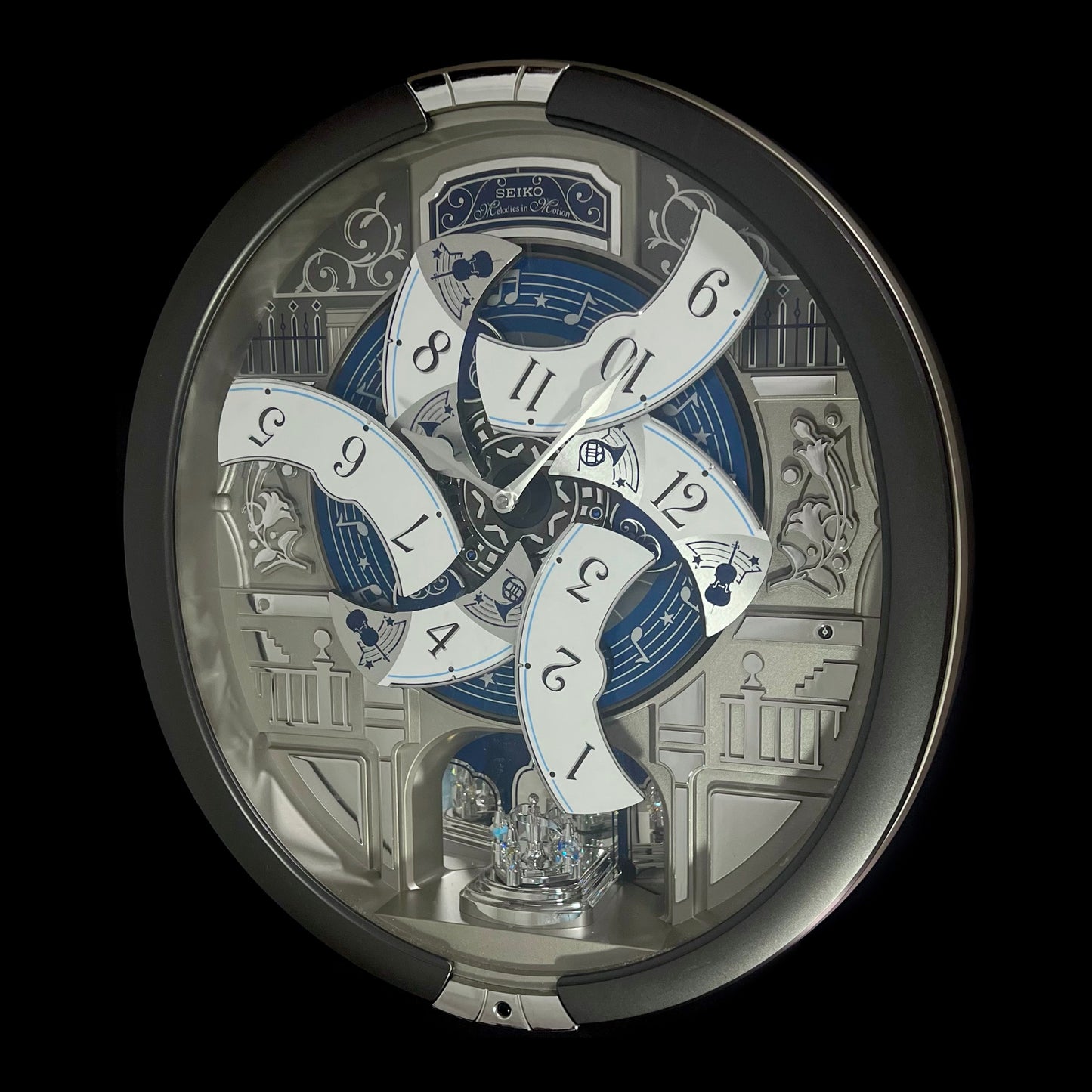 Seiko QXM366SRH “Musical Motifs” Melodies in Motion Dancing Dial Musical Wall Clock