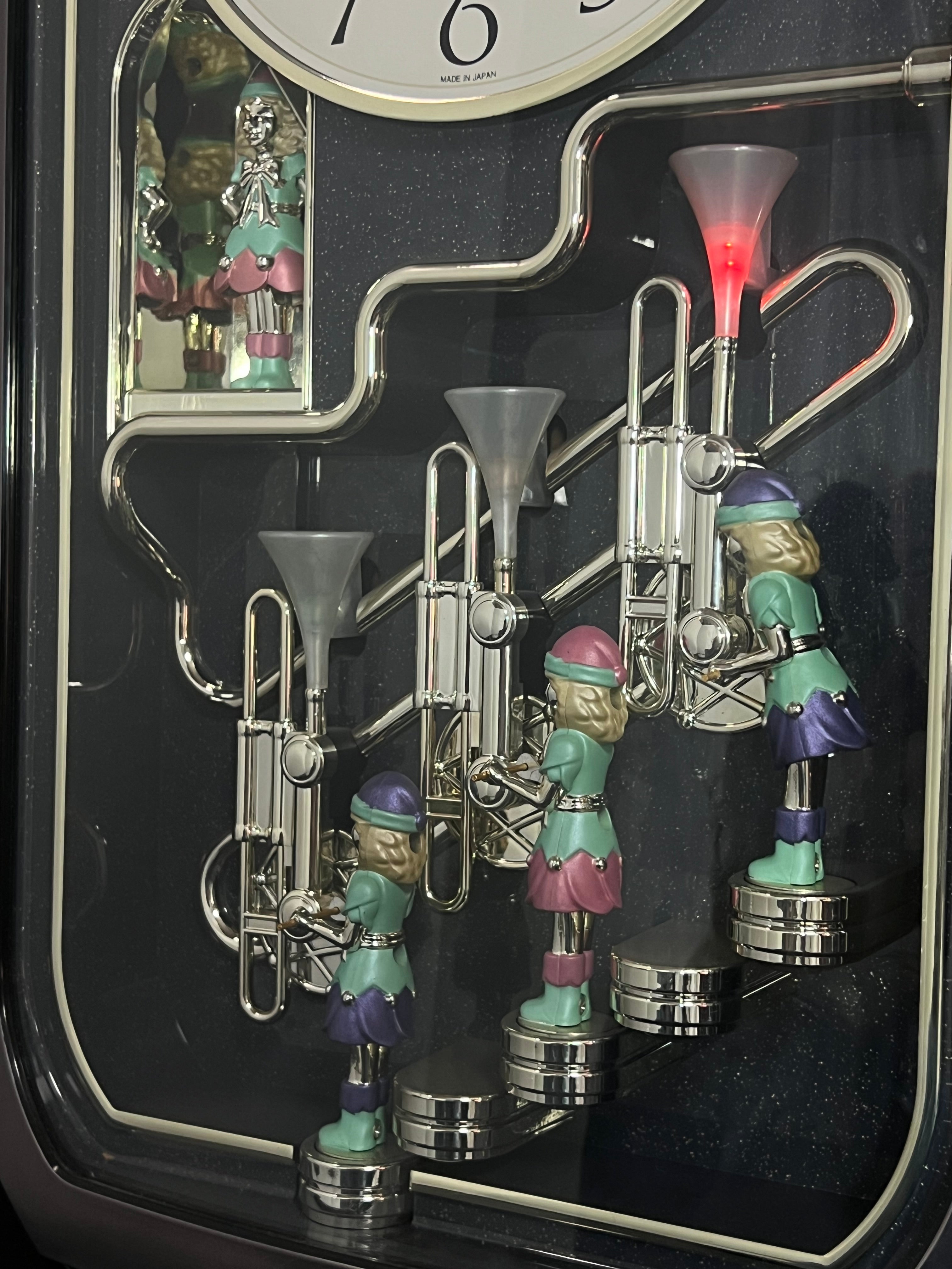 Rhythm "Trumpet Trio" Magic Motion Musical Wall Clock with Animated Figurines - 4MH712-R02