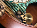 Rhythm “CTS Sundial” Gothic Wooden Musical Motion Pendulum Wall Clock with Popular Melodies - CMJ336UR06