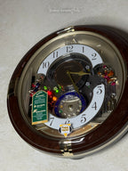 Seiko QXM333BRH "Trumpeting Angels" Melodies in Motion Jaw-Dropping Dial Musical Moving Wall Clock with 13 Songs