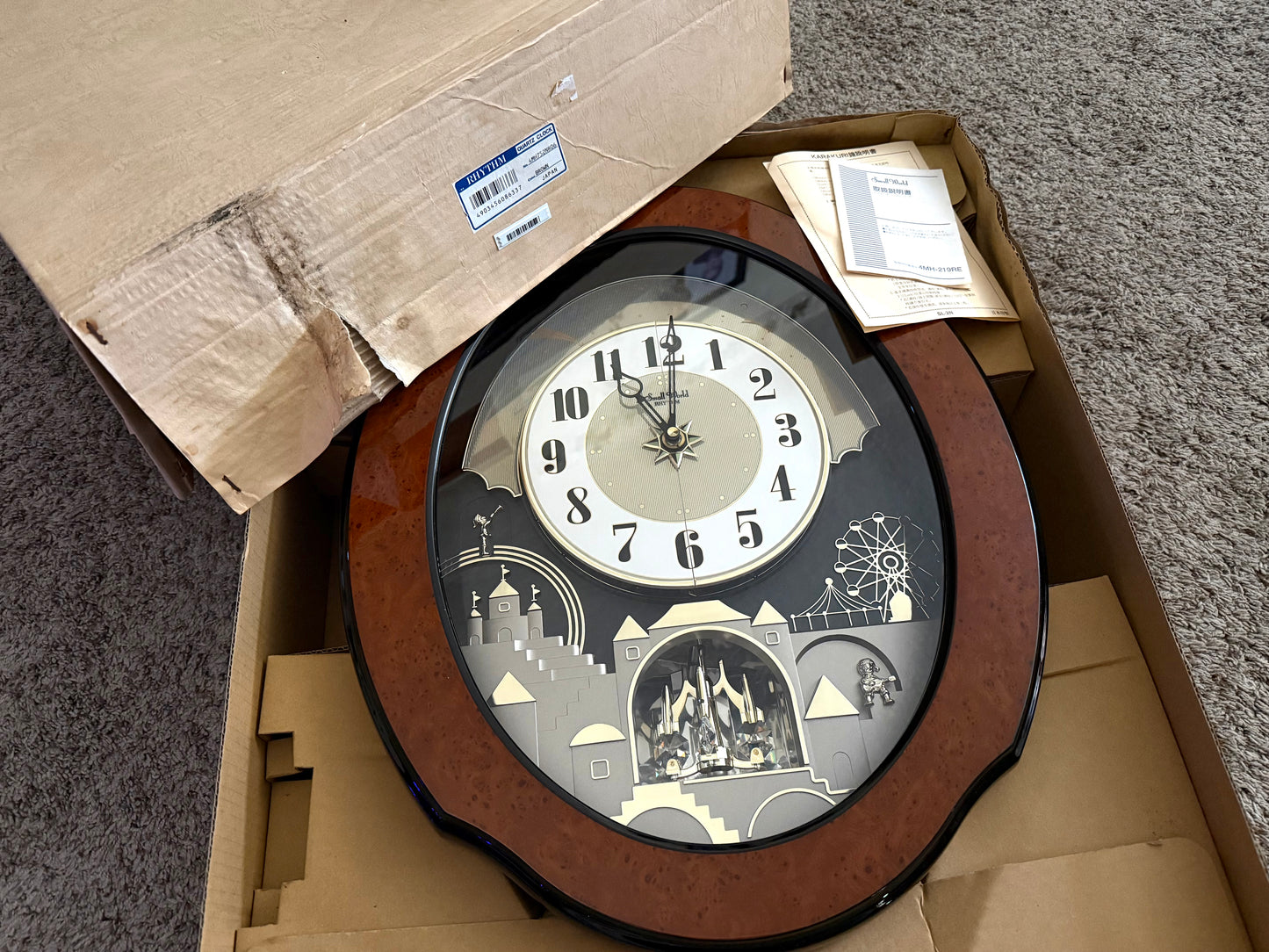 Rhythm “DWS Timecracker” Moving Dial Magic Motion Musical Wooden Wall Clock with Popular Melodies - 4MH752-R06