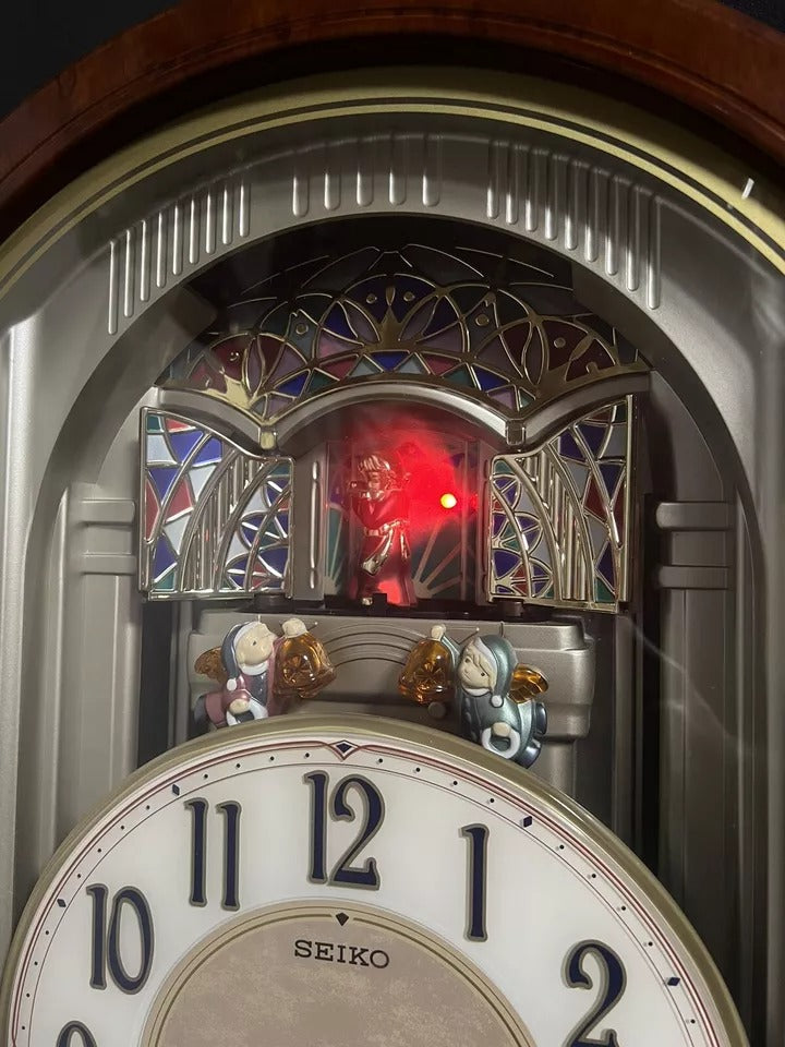 Seiko QXM123BRH "Broadway Showtunes Dropping Dial" Melodies in Motion Musical Moving Wall Clock with Popular Melodies