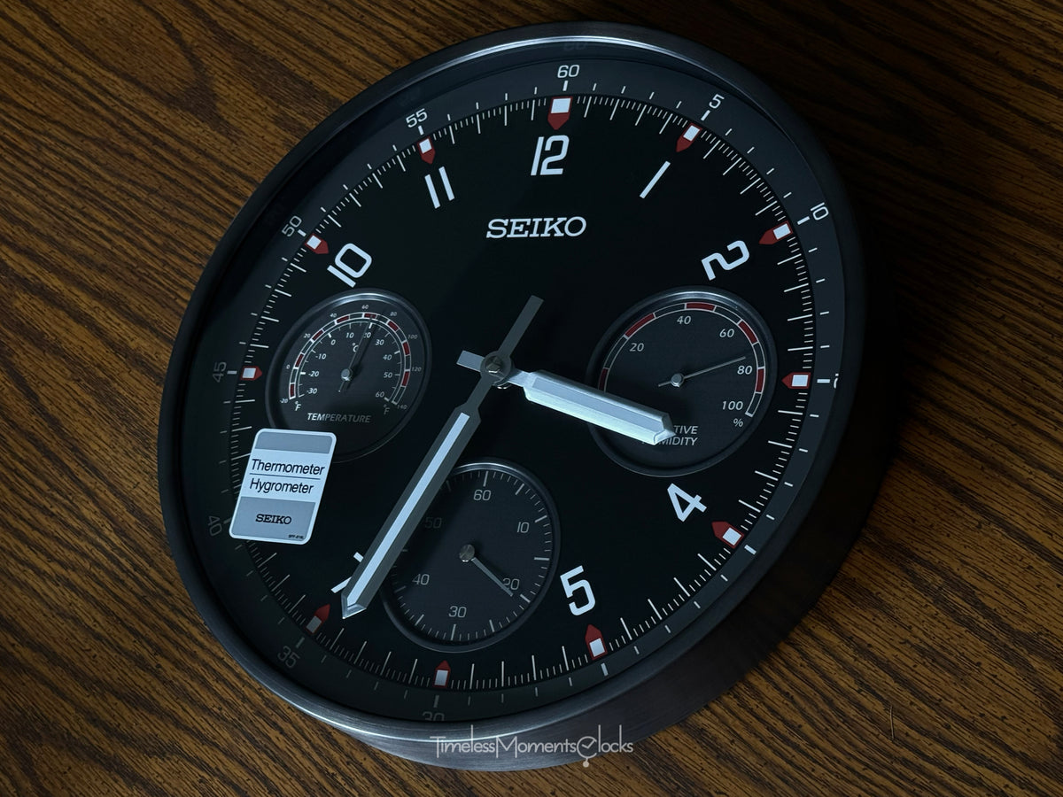 Seiko QXA823KLH "Shelby Watch Dial" Black Heritage Design Metal Wall Clock with Thermometer, Hygrometer, & Seconds Dial