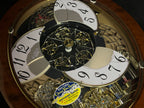 Rhythm "Woodgrain Stars" Moving Dial Magic Motion Musical Wall Clock - 4MH843WS23