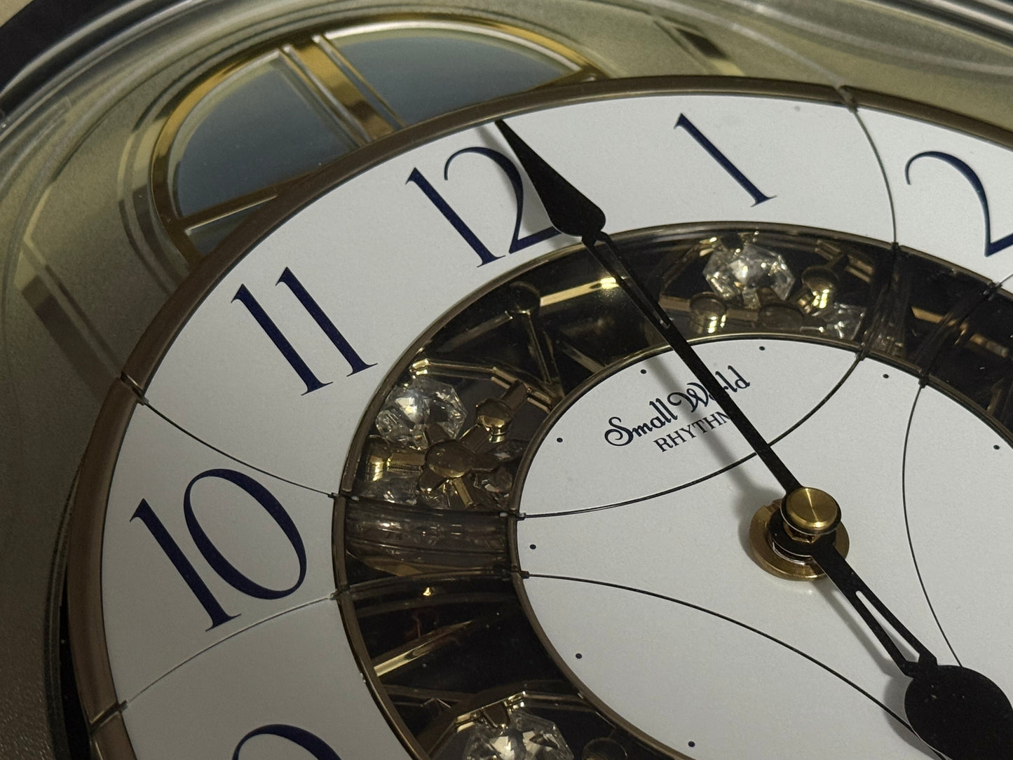 Rhythm "Classic Brilliance" Moving Dial Magic Motion Musical Wall Clock - 4MH787PD18