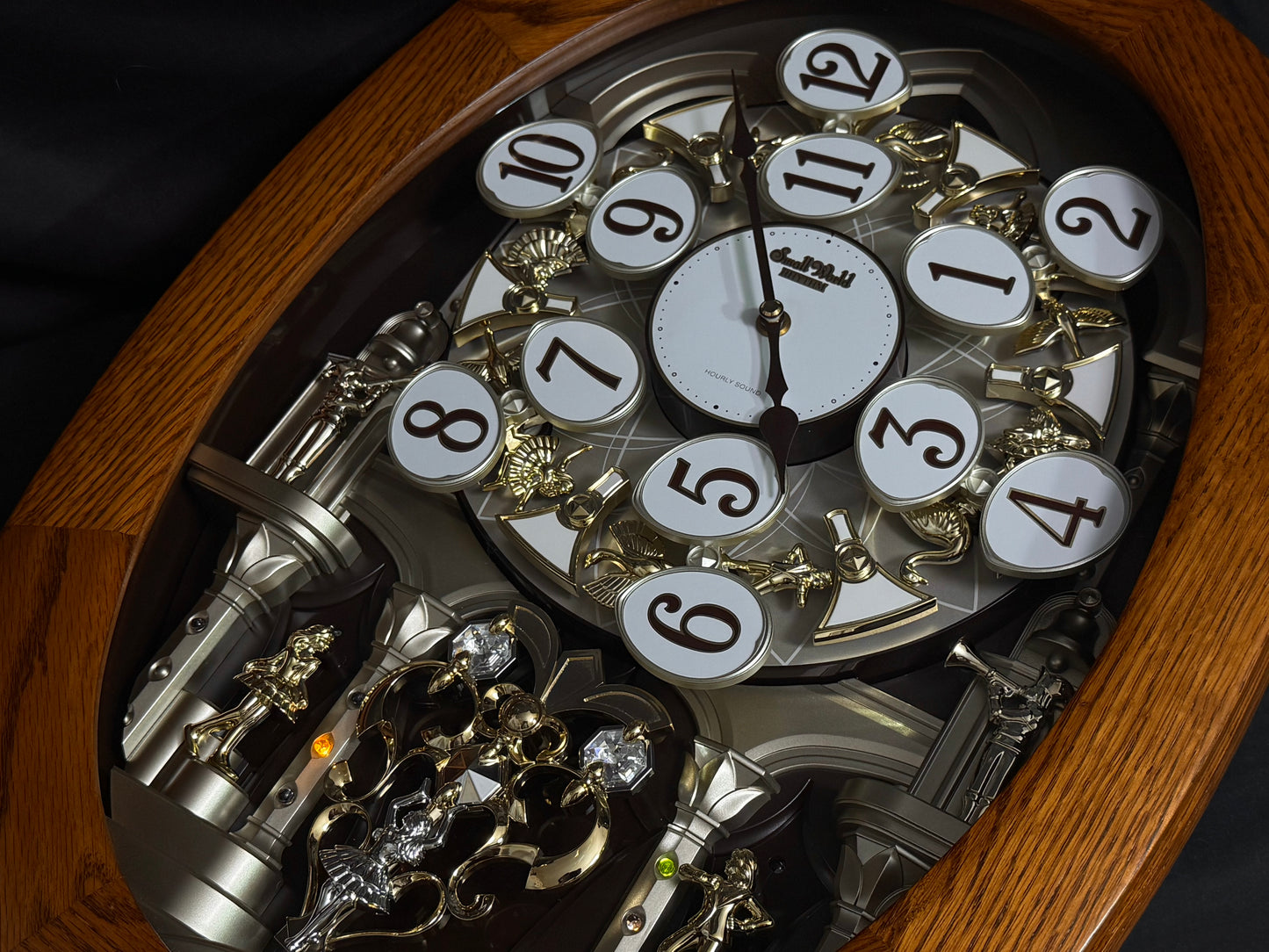 Rhythm "SSS Encore" Magic Motion Musical Wooden Wall Clock with Animated Moving Dial and Popular Melodies - 4MH810-R06