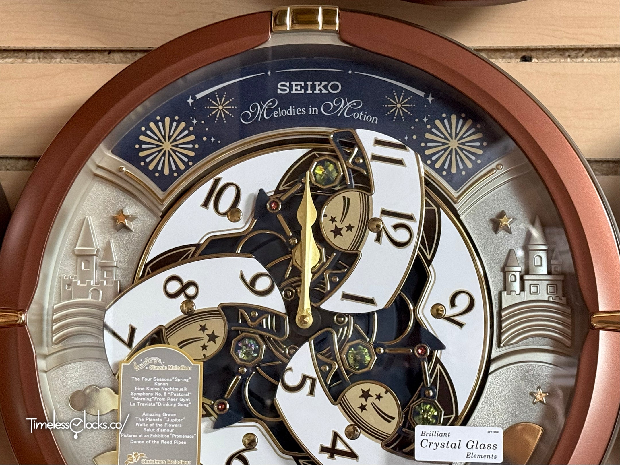 Seiko QXM378BRH “Castle Night” Melodies in Motion Dancing Dial Musical Wall Clock with 18 Songs