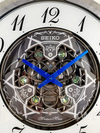 Seiko QXM397SRH “Winter King” Melodies in Motion Dancing Dial Musical Wall Clock with 36 Songs